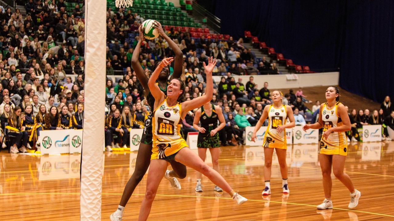 Cavaliers goal attack Esther Kidmas clashed in the air with Northern Hawks goal defence Tessa Coote in the grand final clash at Launceston's Silverdome. Picture: PATRICK GEE/SUPPLIED