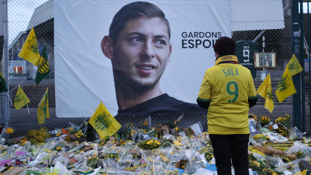 Nantes soccer team supporters stop by a poster of Argentinian player Emiliano Sala. Picture: AP 