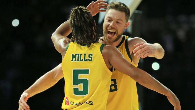 Patty Mills and Matthew Dellavedova of the Boomers celebrate victory over Team USA. Picture: Mark Stewart