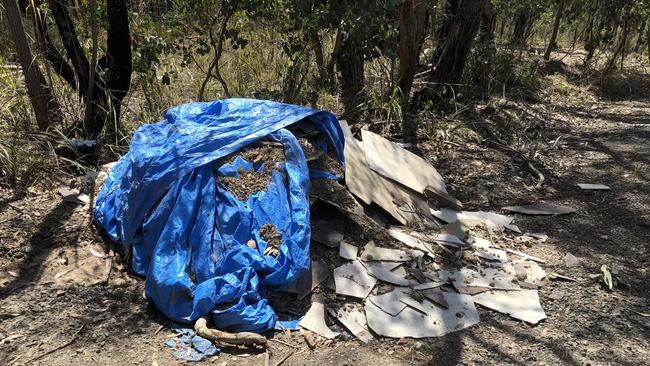 A blue tarp covers a pile of dumped asbestos in Nillumbik. 