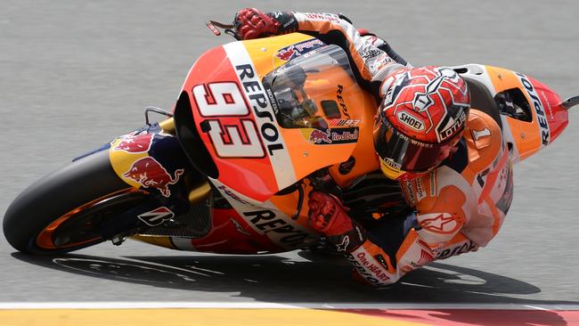 Repsol Honda Team's Spanish rider Marc Marquez steers his bike during the second training session of the MotoGP Grand Prix of Germany at the Sachsenring Circuit on July 10, 2015 in Hohenstein-Ernstthal, eastern Germany. AFP PHOTO / ROBERT MICHAEL