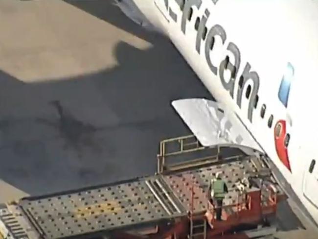 The incident is reportedly unfolding near an American Airlines plane at Sydney airport. Picture: 7 News