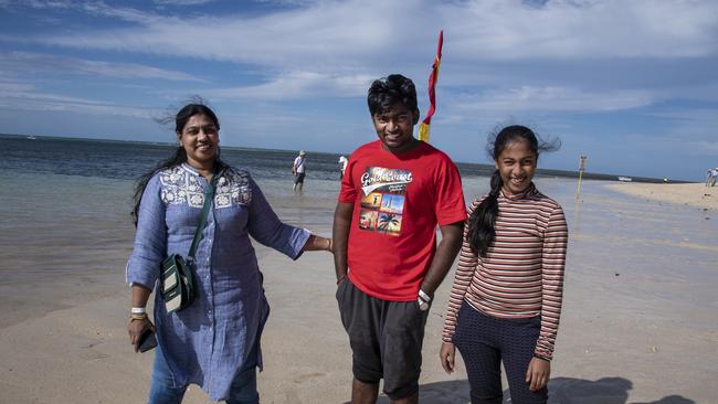 Tourists from Chennai, India, (from left) Adithya Roshan, Sri Hoops and Vasu Bala at Green Island. Picture: Brian Cassey