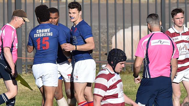 Terrigal’s Pat Niurua is congratulated by teammates after going over to score in the second half during the Central Coast Rugby Union Premier 1 preliminary final against Kariong at Woy Woy Oval. Pictures: Troy Snook