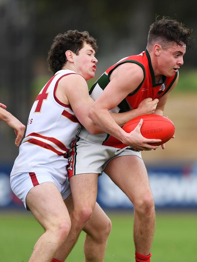 Henley skipper Bailey Chamberlain is tackled by PAC’s Will Staples. Picture: Mark Brake