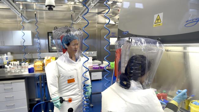 Virologist Shi Zheng-li, left, works with her colleague in the P4 lab of Wuhan Institute of Virology (WIV) in Wuhan in central China's Hubei province in 2017. Picture: Barcroft Media via Getty Images