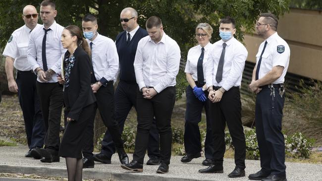 Thomas Nichols, Thomas Pinnington, Jeremy Dale Sandell and Kain Mazomenos, in handcuffs, with guards during a court visit at the crime scene at Adelaide High School. Picture: NCA NewsWire