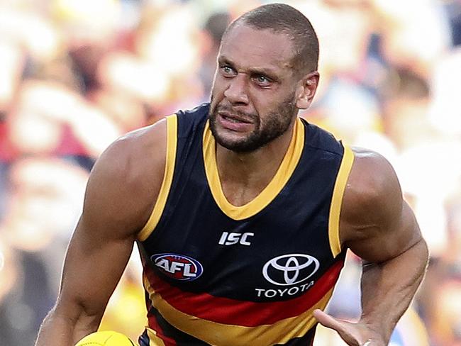 AFL - Adelaide Crows v Gold Coast Suns at Adelaide Oval. cameron Ellis-Yolmen gets his handpass away from Jarrod Witts. Picture SARAH REED