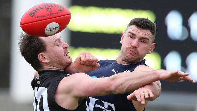 Glenorchy’s James Deegan, left, and Launceston’s Hamish Leedham grapple as they contest the ball. Picture: NIKKI DAVIS-JONES