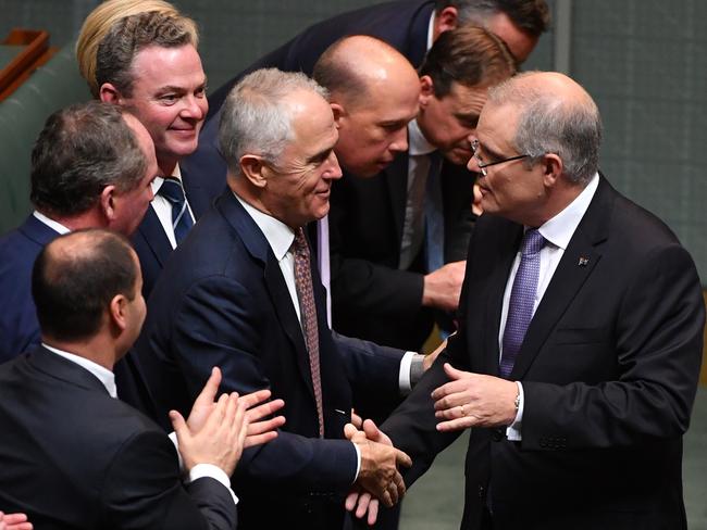 Treasurer Scott Morrison shakes hands with Prime Minister Malcolm Turnbull after delivering the 2017-18 Federal Budget. Picture: AAP