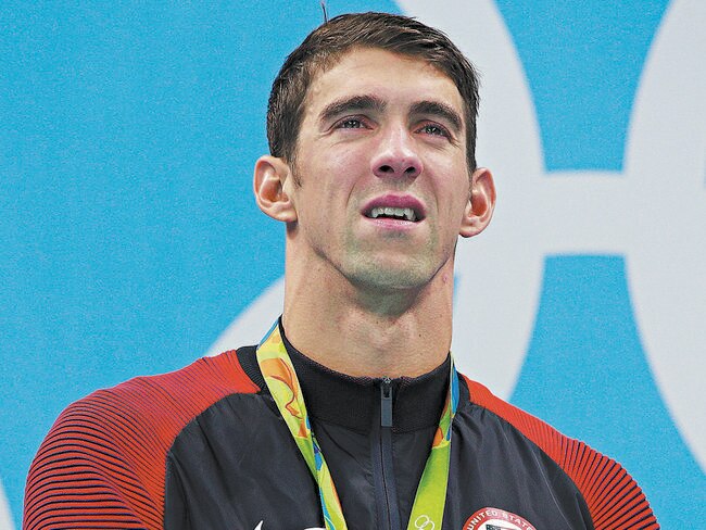 Phelps wears Nike on the podium but told Adweek he has ‘never worn a pair of Nikes in my entire life’. Picture: Adam Pretty/Getty Images