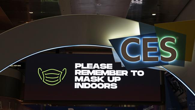 A reminder reads "Please Remember To Mask Up Indoors" at CES 2022 on a monitor at Las Vegas Convention Center January 3, 2022 in Las Vegas, Nevada. Picture: Alex Wong/Getty Images/AFP