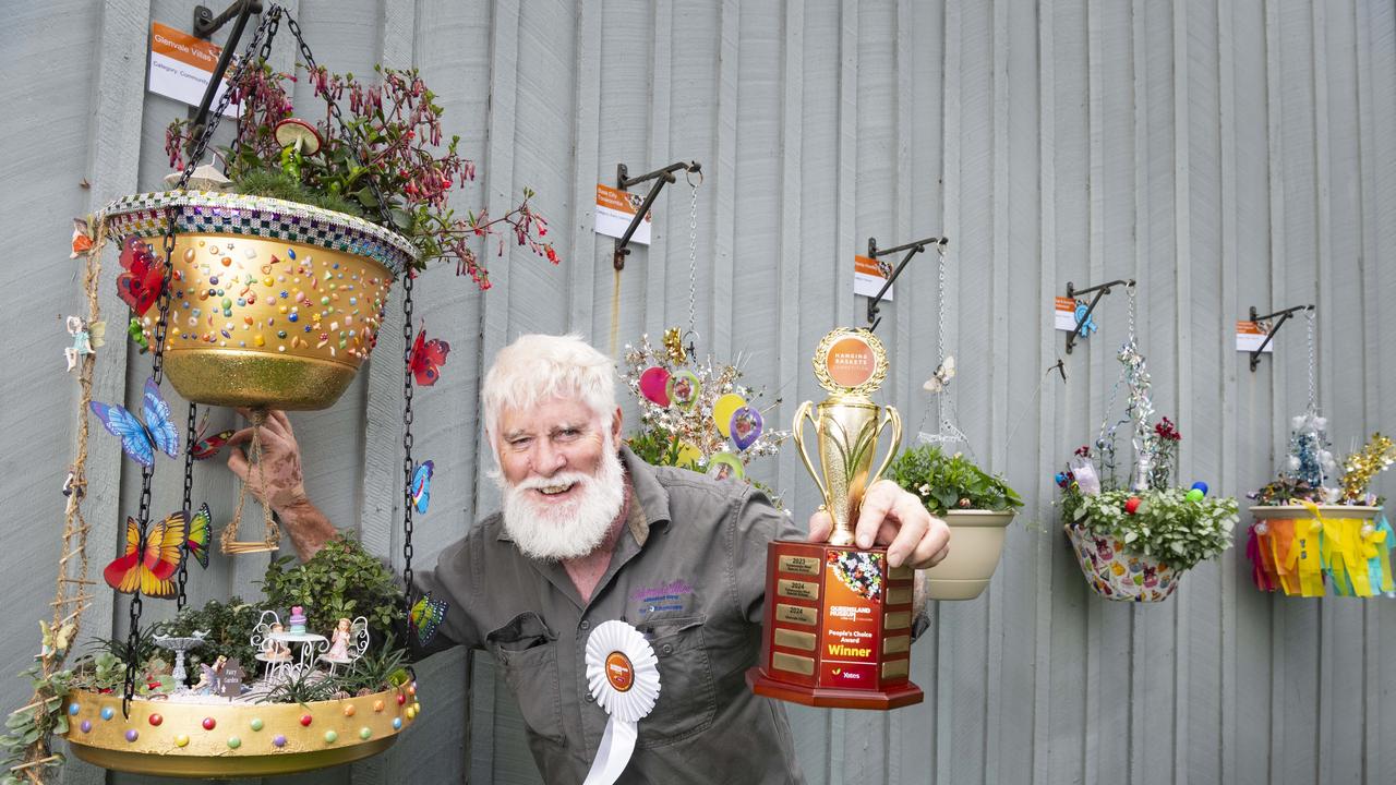 Stewart Dorman of Glenvale Villas shows his excitement as the retirement village is named the joint People's Choice winner of Cobb and Co Museum's Hanging Basket Display. Picture: Kevin Farmer