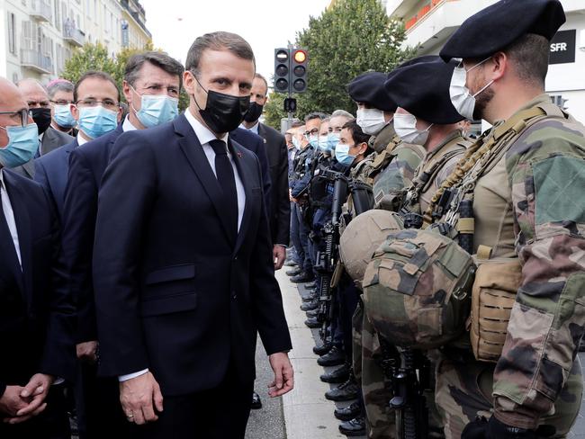 French President Emmanuel Macron and Nice Mayor Christian Estrosi at the scene of a knife attack at a church in Nice. Picture: AFP