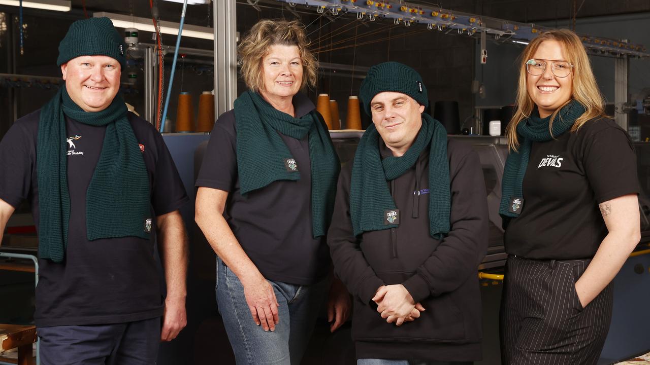 Carl Millward knitting technician Tas Textiles, Linda Goram-Aitken executive manager Tas Textiles, Mathew Midgley sewing assistant Tas Textiles, Kristy Czerniec marketing and content coordinator Tasmania Football Club. Beanies and jumpers for the Tasmania Devils are being made in Tasmania at Tas Textiles in Glenorchy. Picture: Nikki Davis-Jones