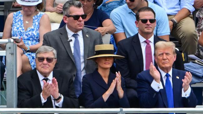 Former US President Donald Trump (R), with former First Lady Melania Trump (C) and her father Viktor Knavs (L), attending the graduation ceremony of Barron Trump. (Photo by Giorgio VIERA / AFP)