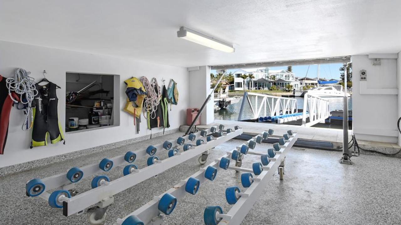 The concealed “secret agent room” set within an external wall of the property with a hydraulic door and offering swift jet ski access to the Broadwater.