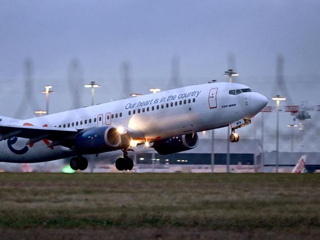 A Rex Airlines Boeing 737 departs Tullamarine Airport in Melbourne on July 29, 2024, after the Australian regional airline announced a trading halt, fuelling speculation of financial challenges. (Photo by William WEST / AFP)