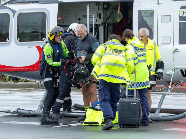Paul and Elizabeth Brennan and dog Trixie have been saved by helicopter from flood waters at their Taree home. Picture Thomas Lisson