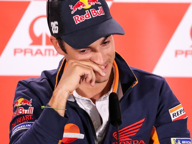 TOPSHOT - Spain's Dani Pedrosa attends a press conference ahead the MotoGP race of the motorcycling Grand Prix at the Sachsenring in Hohenstein-Ernstthal on July 12, 2018. Spain's Dani Pedrosa, three-times a world MotoGP championship runner-up, announced he will retire at the end of the season. The 32-year-old Honda pilot, who won the 125cc category in 2003 and 250cc in 2004 and 2005, currently sits in 12th spot of the MotoGP standings ahead of this weekend's German race in Sachsenring.  / AFP PHOTO / dpa / Jan Woitas / Germany OUT