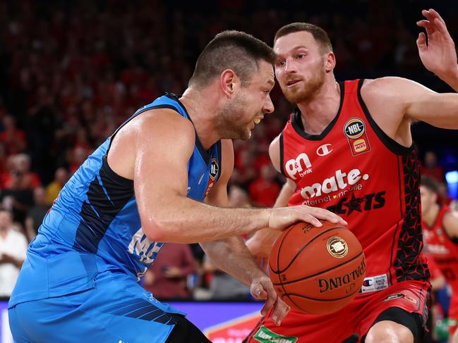 Melbourne United’s Matthew Dellavedova and Perth Wildcats’ Dylan Windler. Picture: Getty Images