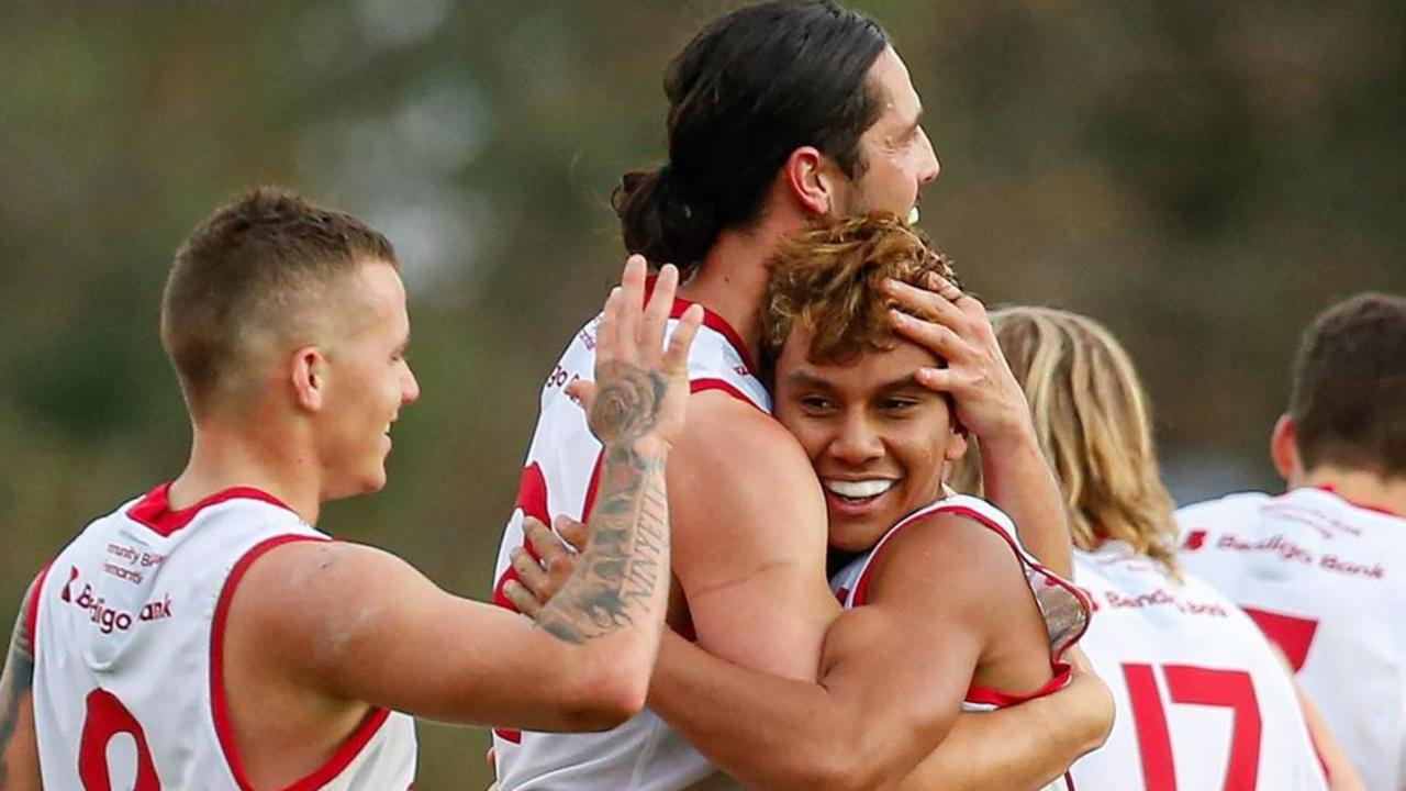 Jesse Motlop celebrates his first senior WAFL goal with teammates.