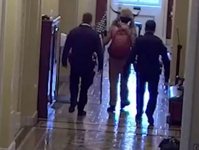 Jacob Chansley is escorted from the US Capitol by police. Picture: Supplied