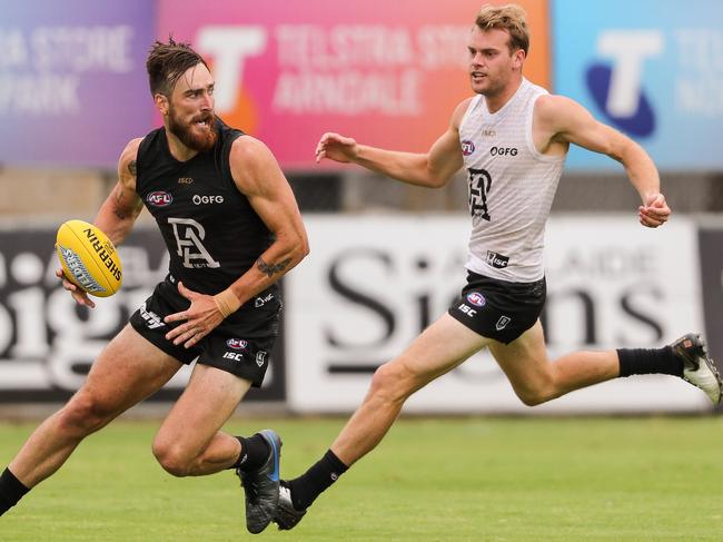 ADELAIDE, AUSTRALIA - FEBRUARY 14: Charlie Dixon being chased by \\Jack Watts during the Port Adelaide Power Intra-Club match at Alberton Oval on February 14, 2020 in Adelaide, Australia. (Photo by Matt Turner/AFL Photos via Getty Images)