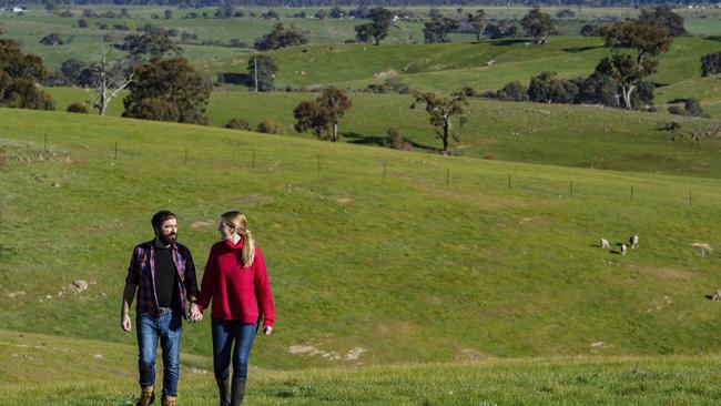 Hills are alive: Megan Stewart and Anthony Morabito on their farm at Mia Mia. Picture: Zoe Phillips