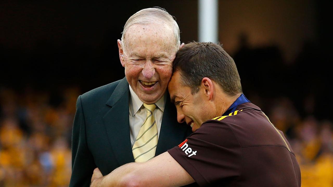 Footy legend John Kennedy Snr has passed away. He presented to the 2013 premiership cup to Hawks coach Alastair Clarkson in 2013. Picture: Michael Willson