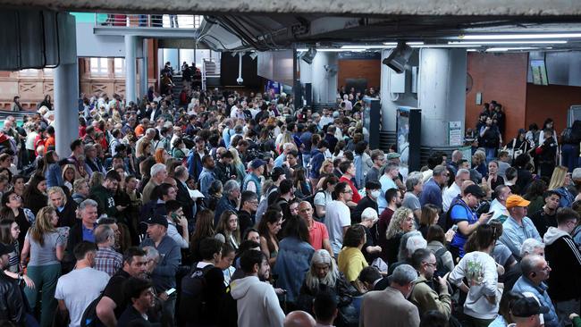 Passengers wait for their trains at Atocha station in Madrid on April 29, 2025, the day after a massive power cut affecting the entire Iberian peninsula and the south of France. Electricity was restored to almost all of Spain and Portugal on April 29 morning, allowing a gradual return to normal life in the two countries, which were hit on April 28 by a giant blackout that lasted up to ten or even twenty hours depending on the region. The return of power has enabled rail traffic to be restored on several major routes, including Madrid-Seville and Madrid-Barcelona, according to the national company Renfe. However, traffic remains suspended on several other major routes, as the authorities have given priority to restoring suburban trains. (Photo by Thomas COEX / AFP)