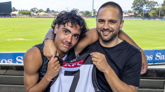 Jase Burgoyne, Peter Burgoyne and the No. 7 Power guernsey. Picture: Kelly Barnes