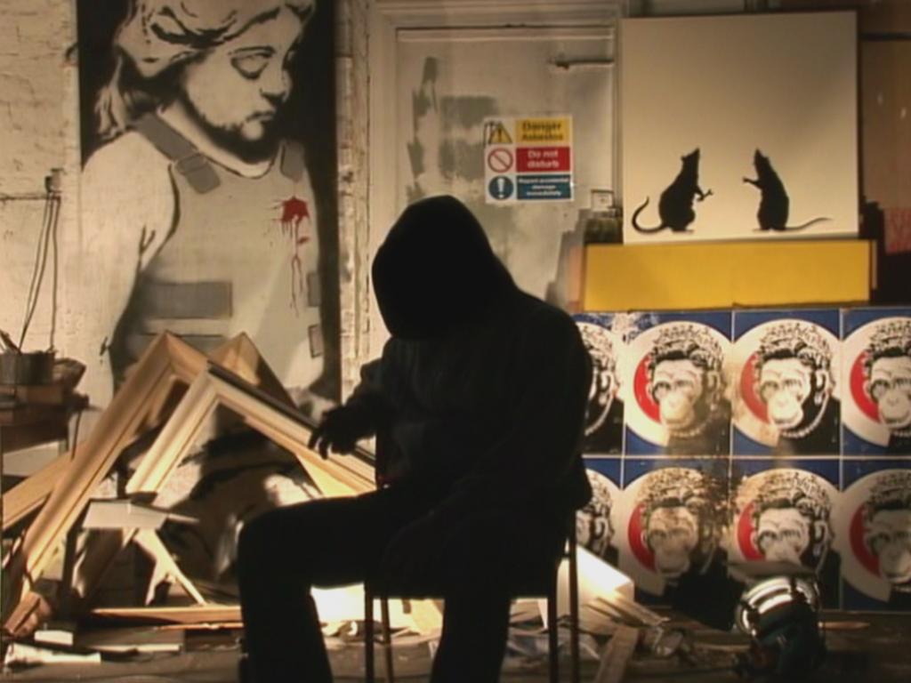 A shadowy figure purported to be Banksy in a scene from the film Exit Through The Gift Shop.