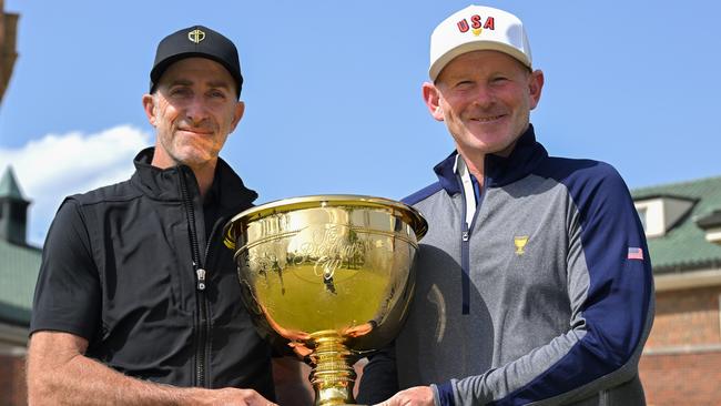 MEDINAH, ILLINOIS - APRIL 28: Team U.S.A. Captain, Brandt Snedeker, and Team International Captain, Geoff Ogilvy of Australia, hold the Presidents Cup together at Medinah Country Club on April 28, 2025, in Medinah, Illinois. (Photo by Ben Jared/PGA TOUR)