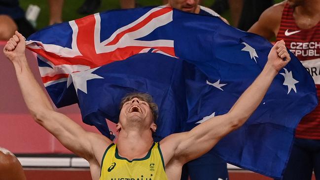 Bronze medallist Australia's Ashley Moloney celebrates after the men's decathlon event during the Tokyo 2020 Olympic Games at the Olympic Stadium in Tokyo on August 5, 2021. (Photo by Ina FASSBENDER / AFP)