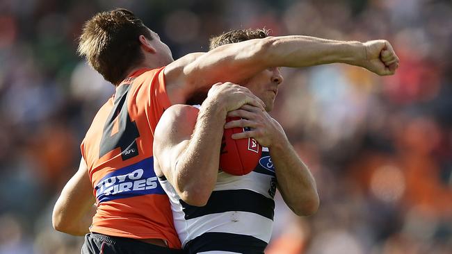 Joel Selwood cops one high from Toby Greene. Picture: Getty