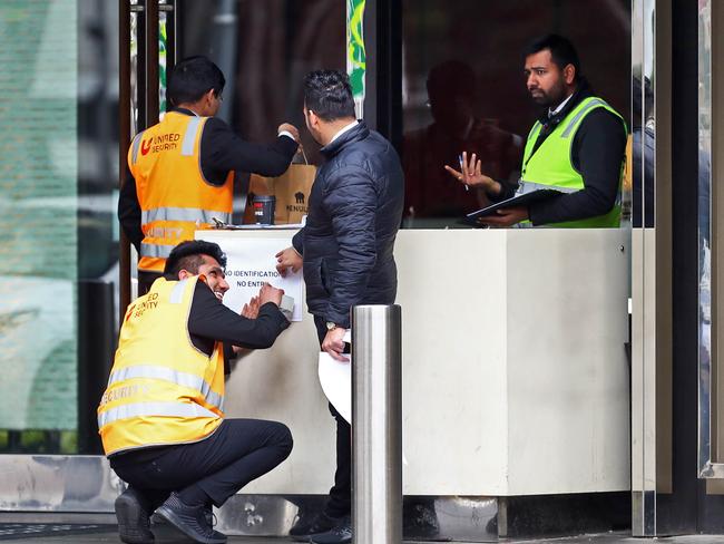 Unified security guards man the doors outside the quarantine hotel Crown Promenade. Picture: Aaron Francis/The Australian