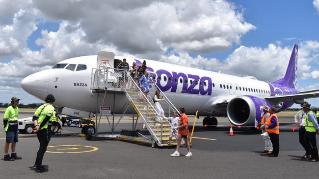 The first customers coming off the Bonza flight at Rockhampton Airport.