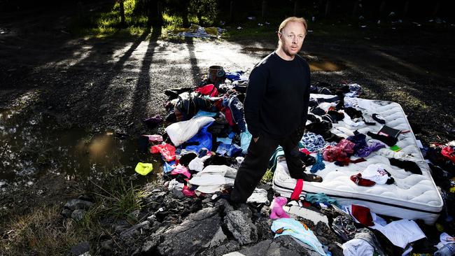 Woori Yallock resident Jamie Keogh is fed up with people dumping rubbish by the yarra river instead of taking it to the tip. His calls to the council to have the rubbish removed have been unanswered. Picture: Paul Loughnan