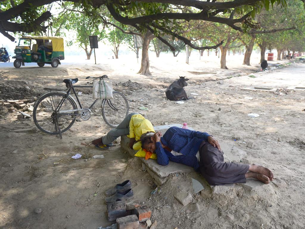 Indian people rest under a tree during a hot summer afternoon in Allahabad on June 2, 2019. — Temperatures passed 50 degrees Celsius in northern India as an unrelenting heatwave triggered warnings of water shortages and heatstroke. Picture: Sanjay Kanojia/AFP