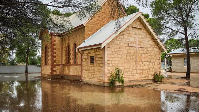 Water rises in the streets of Morgan in the Riverland on Sunday. Picture: Matt Loxton