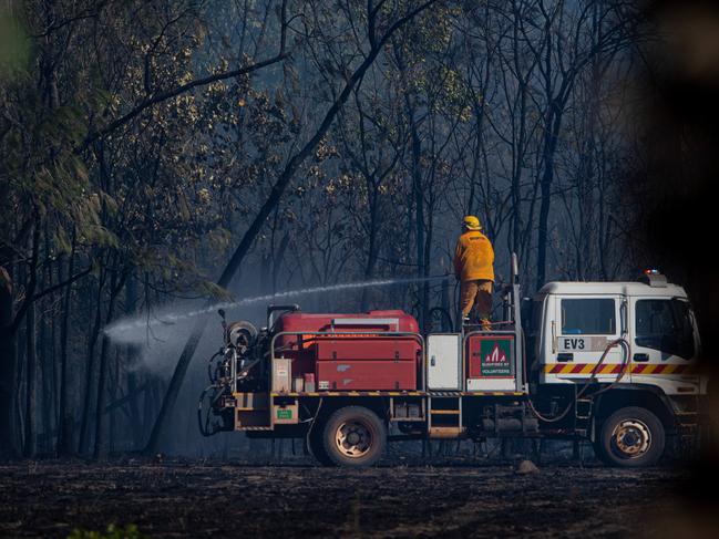 ABOUT eight properties were under threat in the Livingstone area as a bushfire ripped through the area.Three aircraft, four helicopters and 20 volunteer crews and Bushfires NT fireys battled together to contain the blaze on Perentie Rd. one firefighter was injured an admitted to hospital with burns. Picture: Che Chorley