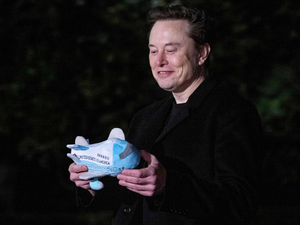 Musk looked pretty chuffed with his stuffed Air Force One toy upon arrival with President Trump on the South Lawn of the White House in Washington, DC, on February 19. Picture: Jim Watson/AFP