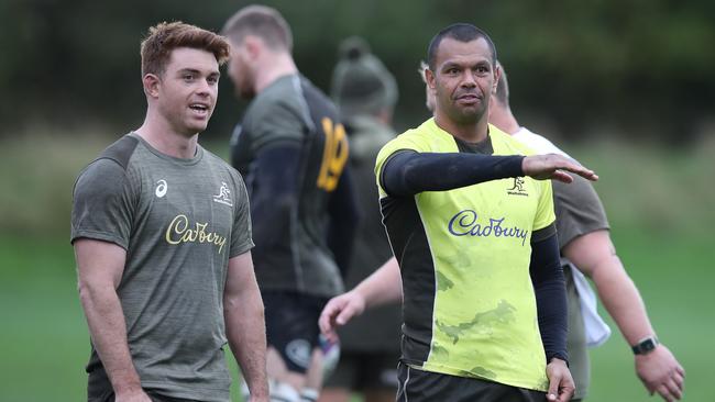 Wallabies pair Andrew Kellaway (left) and Kurtley Beale discuss tactics at training. Picture: Ian MacNicol/Getty Images