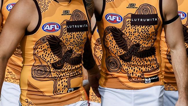 ADELAIDE, AUSTRALIA - MAY 19:  Jarman Impey and   Karl Amon of the Hawks  lead their  team out during the round 10 AFL match between Yartapuulti (the Port Adelaide Power) and Hawthorn Hawks at Adelaide Oval, on May 19, 2024, in Adelaide, Australia. (Photo by Mark Brake/Getty Images)