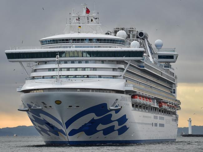 The Diamond Princess cruise ship, with over 3,700 people quarantined onboard due to fears of the new coronavirus, arrives at the Daikoku Pier Cruise Terminal in Yokohama port on February 6, 2020. (Photo by Kazuhiro NOGI / AFP)