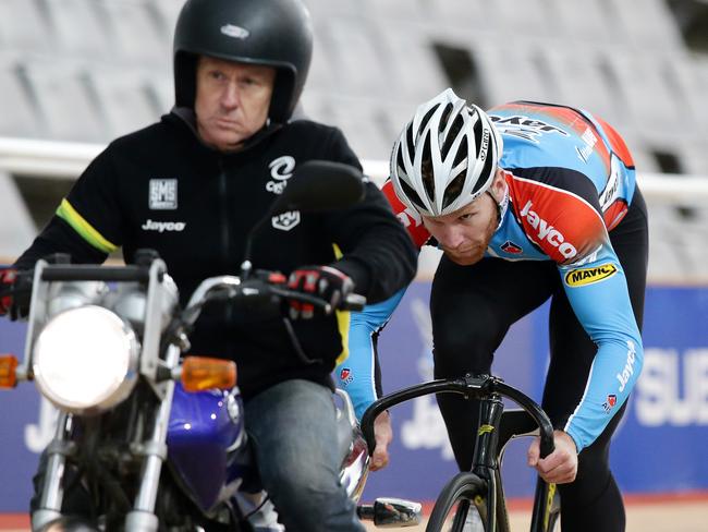 Pete Lewis sits behind David Short on the motorbike during a training session at the SuperDrome. Picture: Sarah Reed