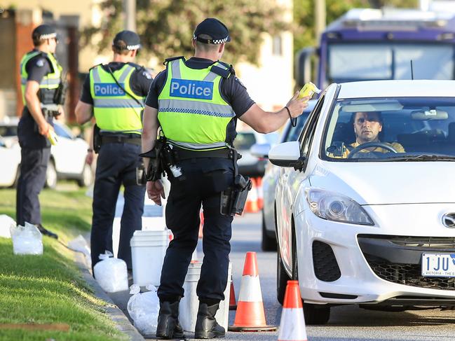 Police breath test drivers along the Esplanade in St Kilda. Picture: Martin Keep