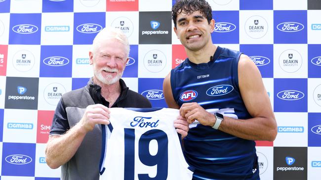 Former Geelong player Neville Bruns presents Jack Martin with the No.19. Picture: Geelong Cats