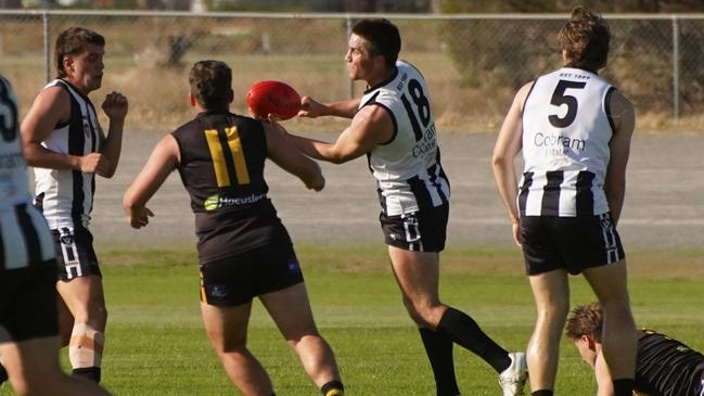 Will Perryman tries to get a handpass away before he is tackled. Picture: Kate Perryman - Finding Focus Photography.